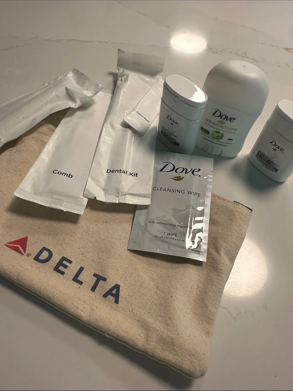 NWOT- Delta Travel Amenity Pouch with Toiletries in Beige and Red/Blue Logo